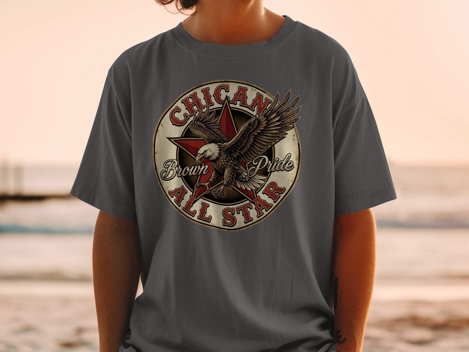 T-shirt featuring an eagle with "Chicano Pride All Star" text in a circular emblem.