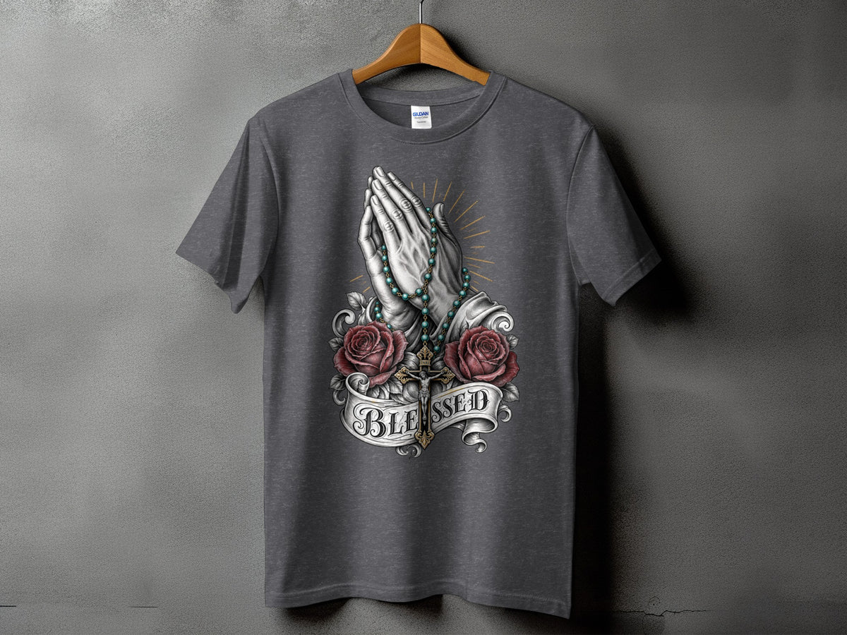 Dark grey t-shirt with praying hands, roses, rosary, and "BLESSED" text.