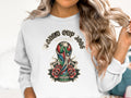 World Cup 2026 North America trophy with roses graphic on white sweatshirt.