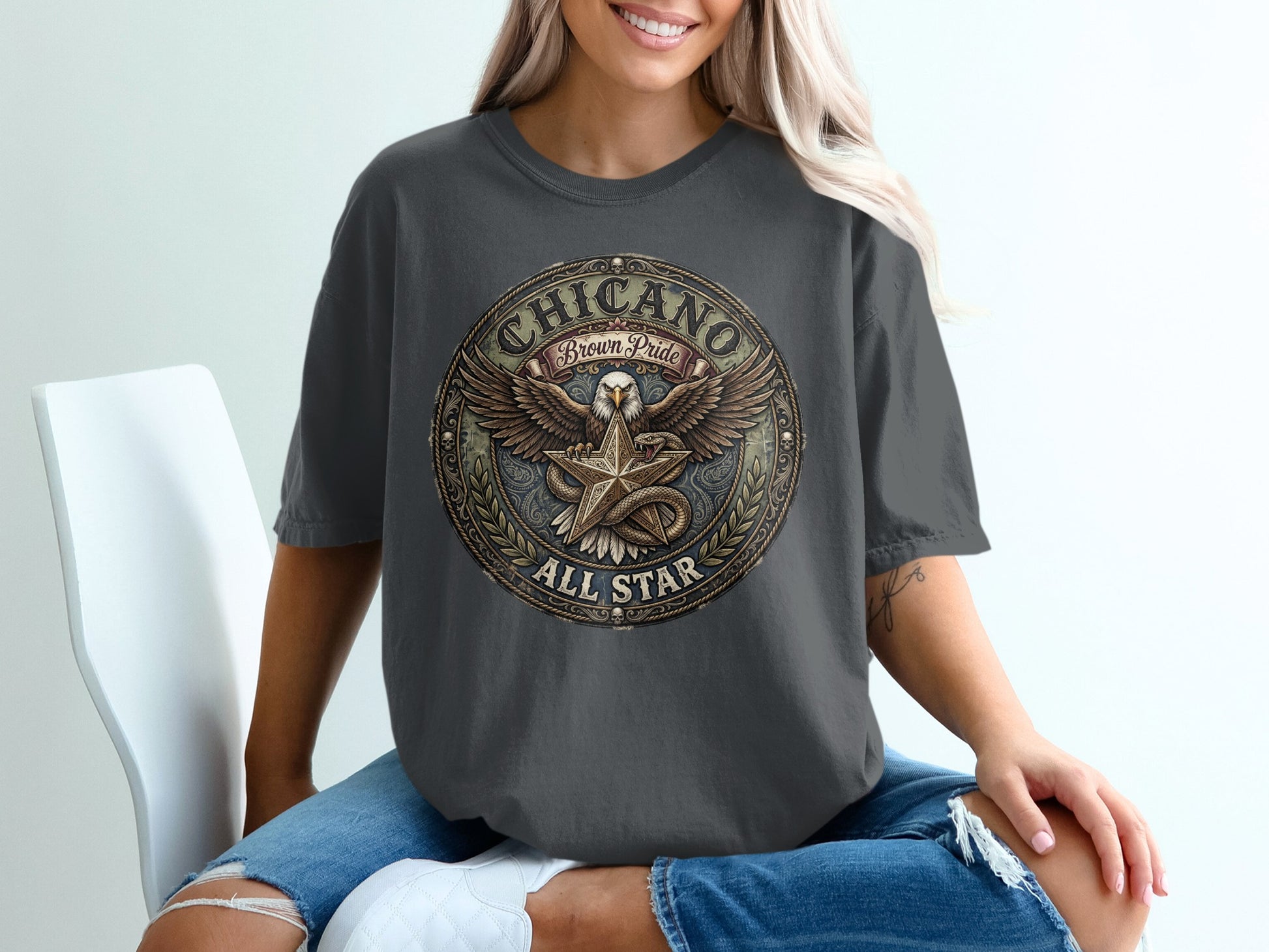 Dark grey t-shirt with a circular "Chicano Brown Pride All Star" graphic featuring an eagle.