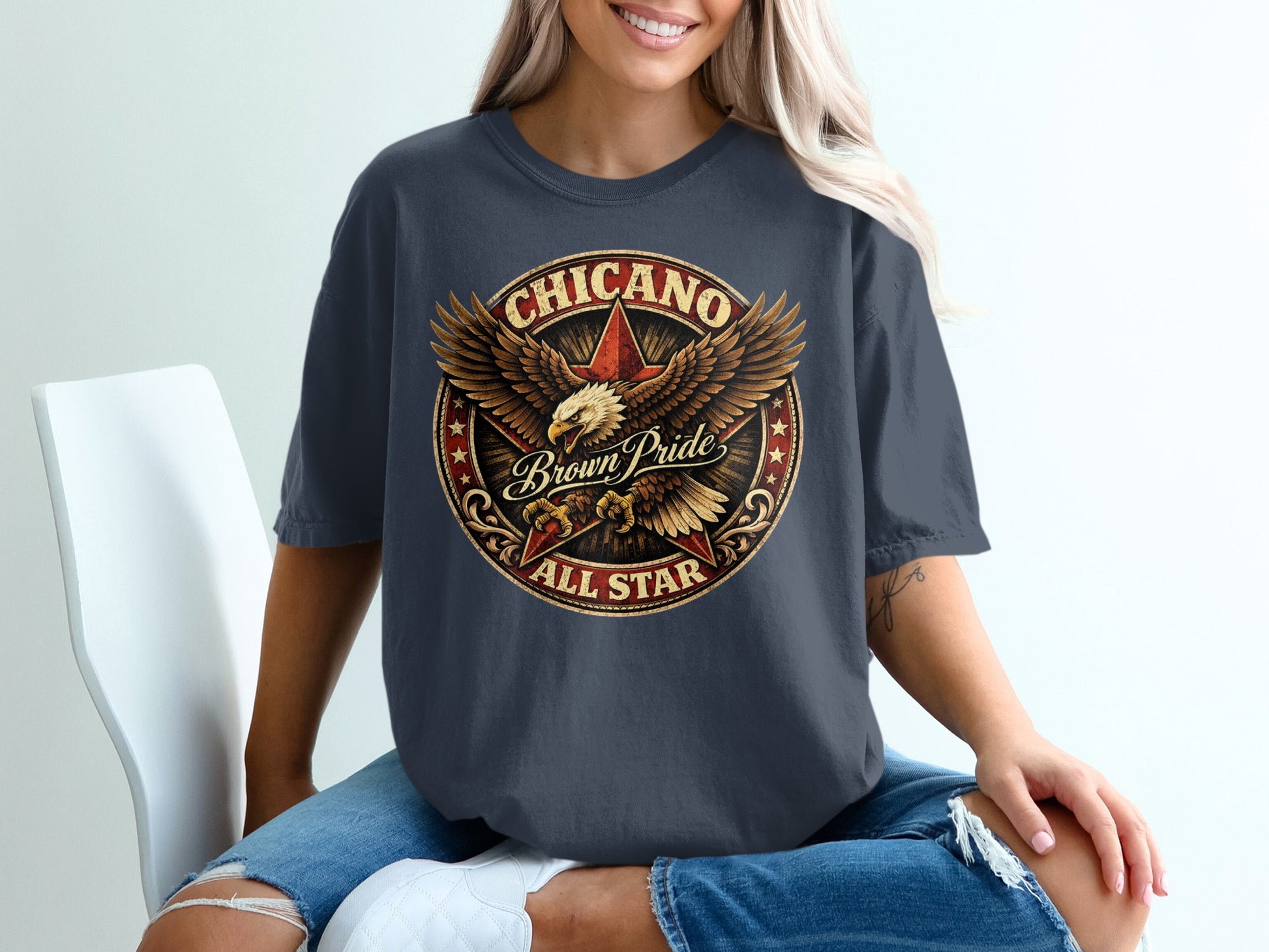 Dark t-shirt with circular "Chicano Brown Pride All Star" eagle graphic.