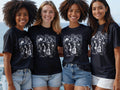 Four women in denim shorts and t-shirts featuring a 