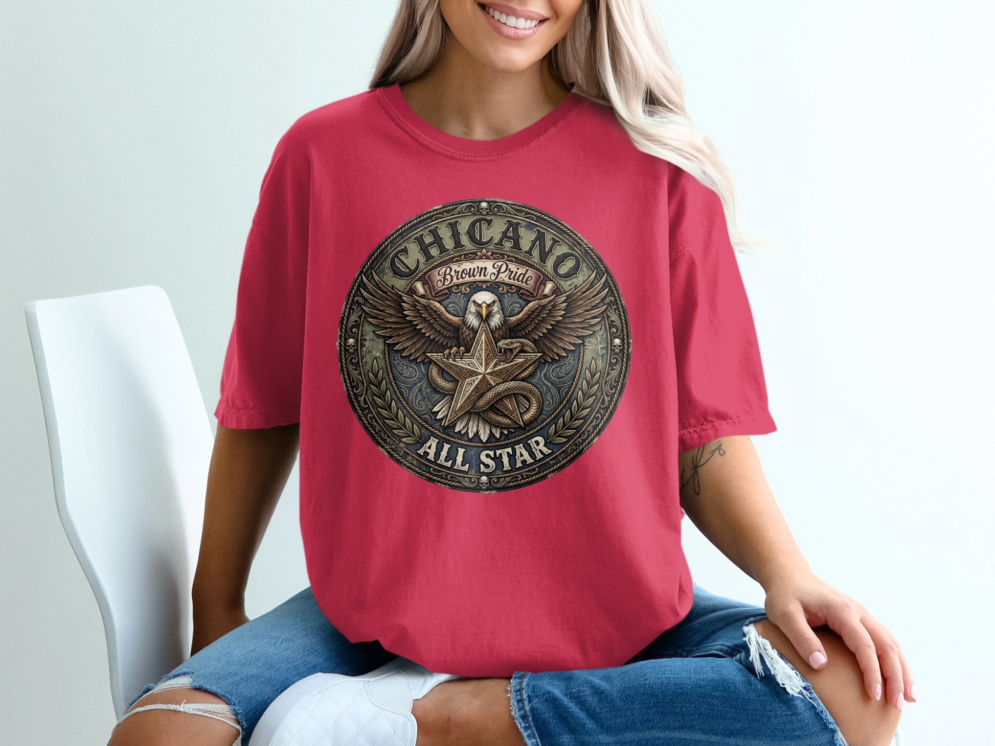 Red t-shirt with "Chicano Brown Pride All Star" eagle emblem.