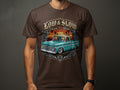 Graphic tee with vintage teal pickup truck, roses, and text 