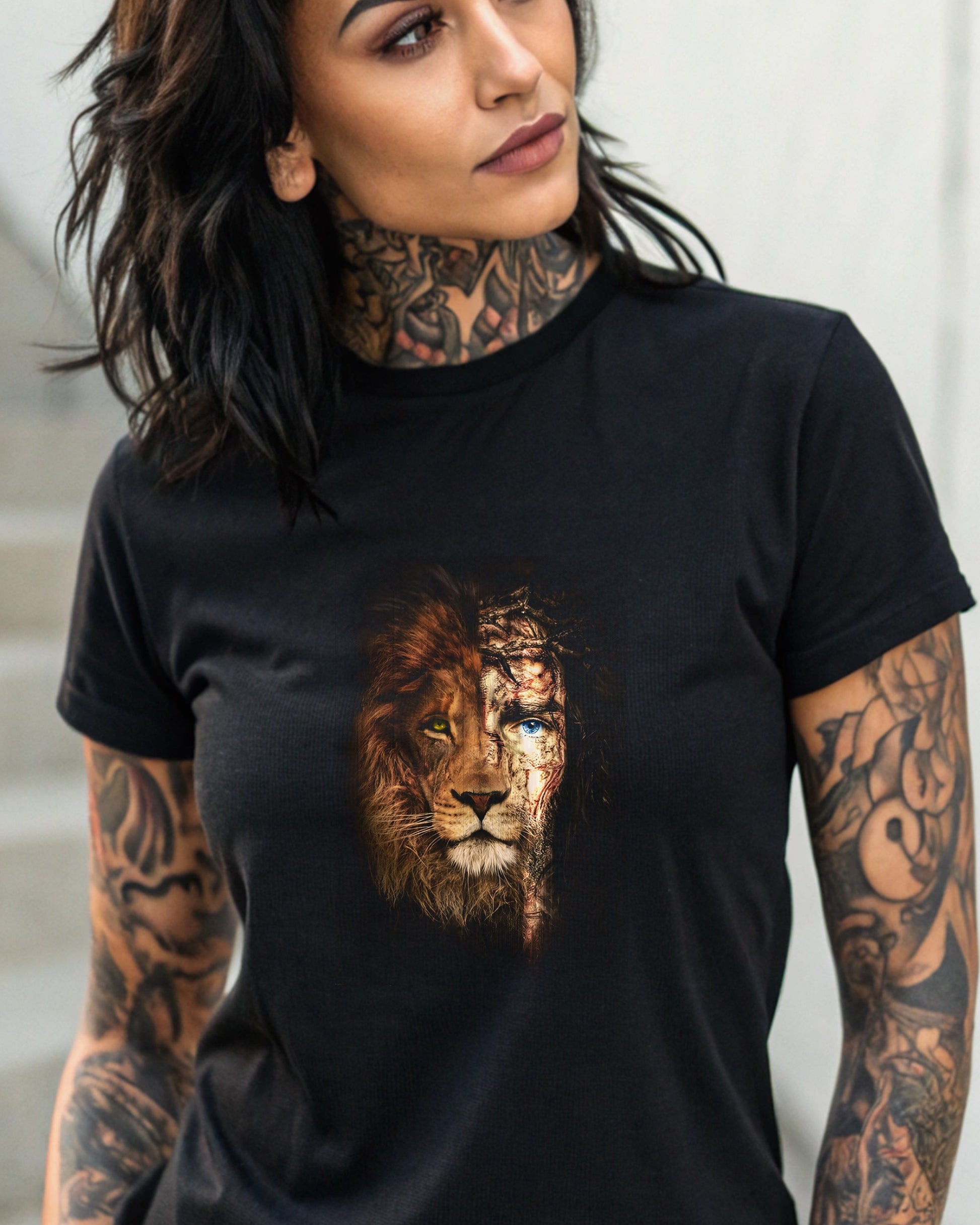 Black t-shirt with a split design of a lion's face and Jesus Christ's face.
