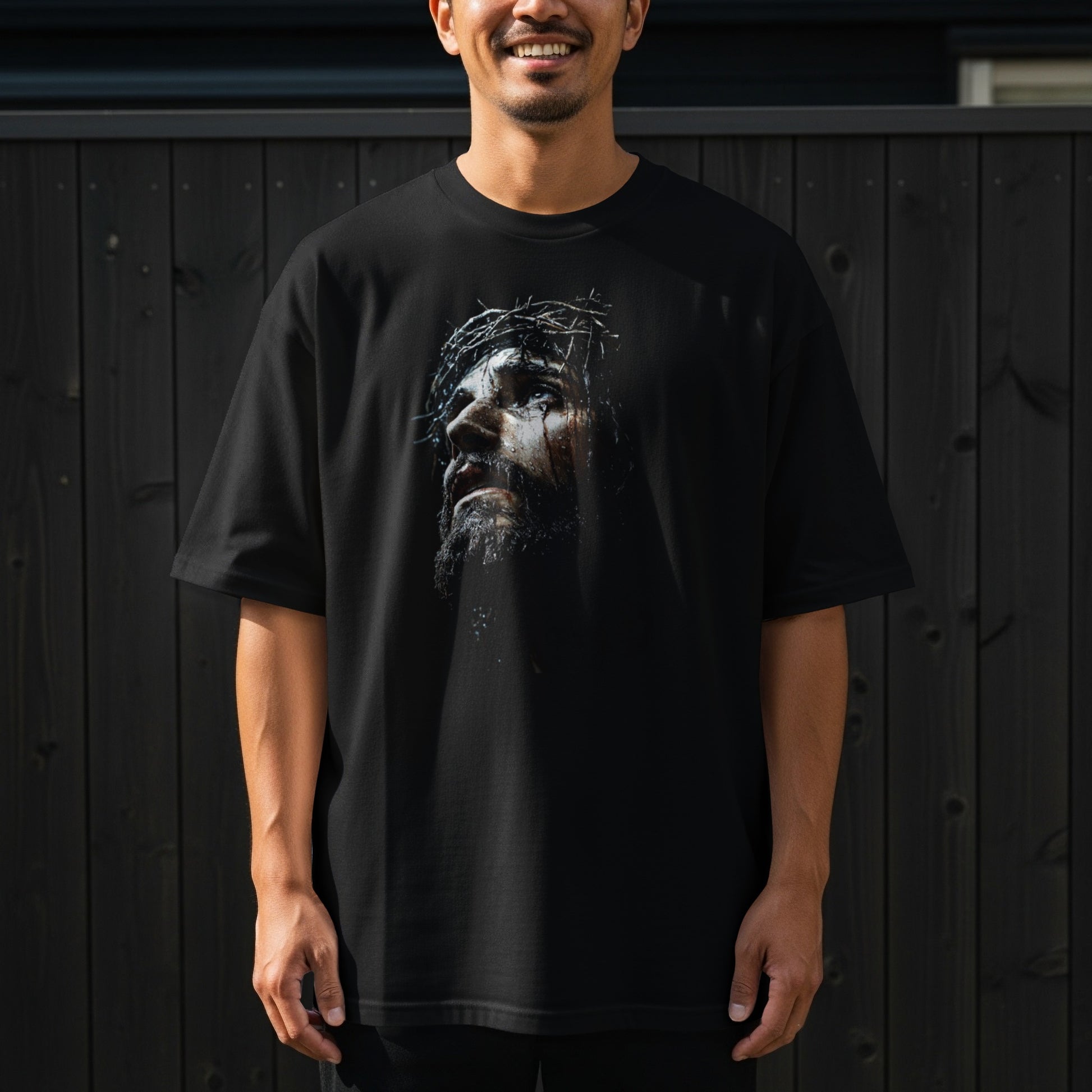 Black t-shirt with a portrait of Jesus wearing a crown of thorns.