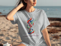 Gray t-shirt with World Cup 2026 North America logo on a woman.