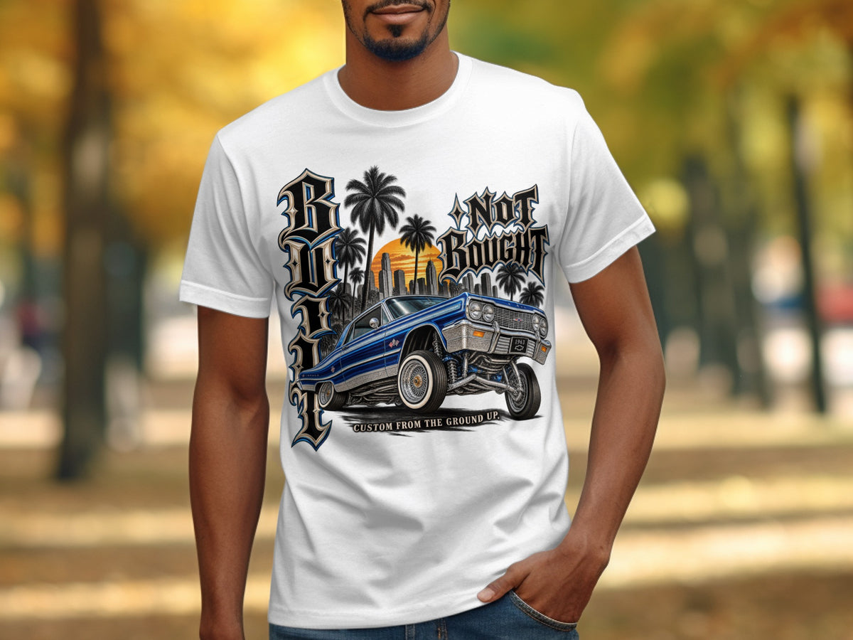 White t-shirt with graphic of a blue custom 1963 Impala lowrider car.