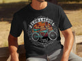 Black t-shirt with graphic of vintage bicycle, palm trees, and text 