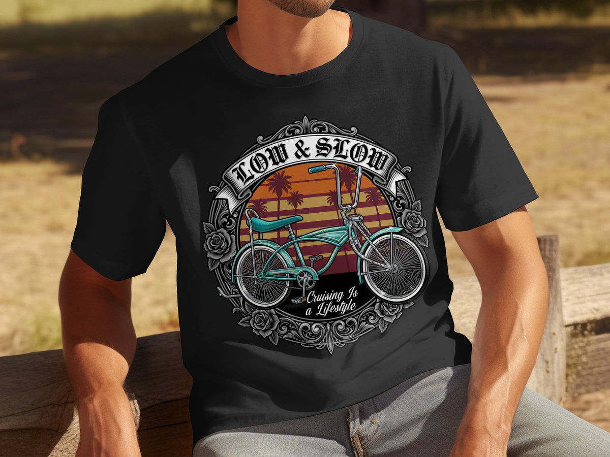 Black t-shirt with graphic of vintage bicycle, palm trees, and text "LOW & SLOW" and "Cruising Is a Lifestyle".