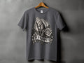 Dark grey t-shirt with praying hands, rosary, rose, and banner text 