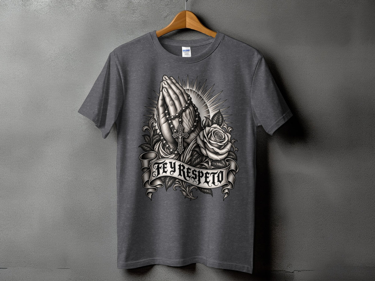 Dark grey t-shirt with praying hands, rosary, rose, and banner text "FE Y RESPETO."