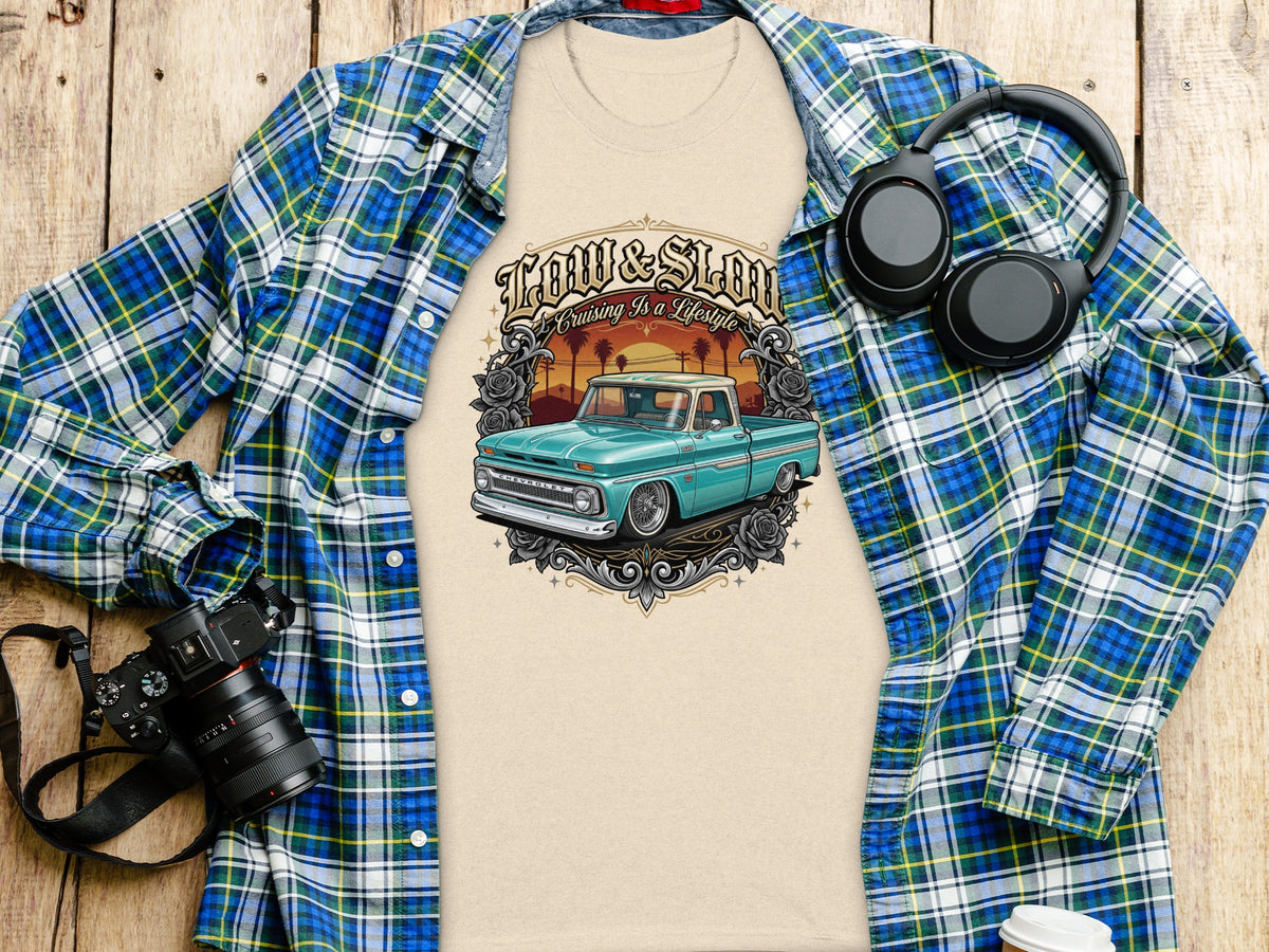 T-shirt with a graphic of a teal lowrider truck and text "Low & Slow Cruising Is A Lifestyle".
