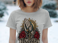 Grey t-shirt featuring praying hands, rosary, cross, roses, and the word 