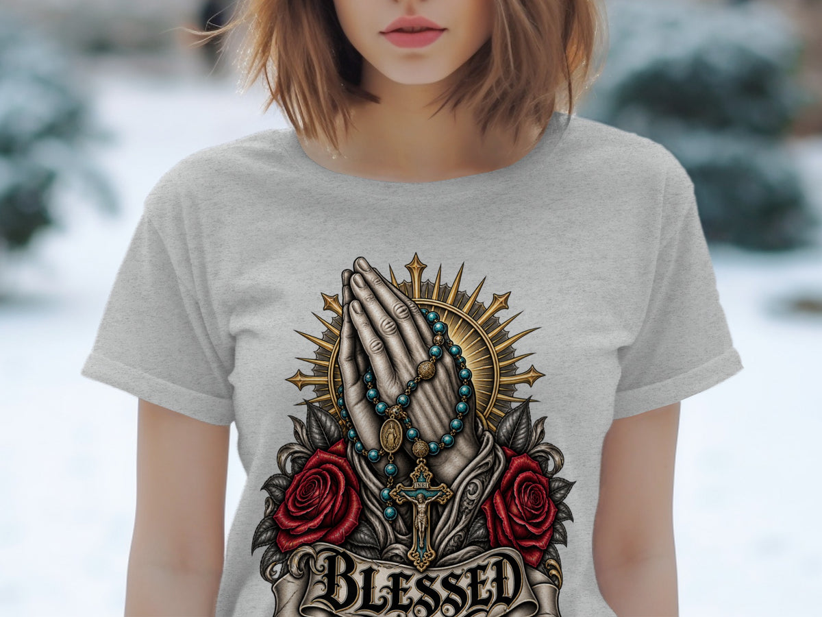 Grey t-shirt featuring praying hands, rosary, cross, roses, and the word "BLESSED".