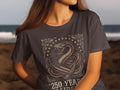 Dark t-shirt with coiled snake and American flag design.