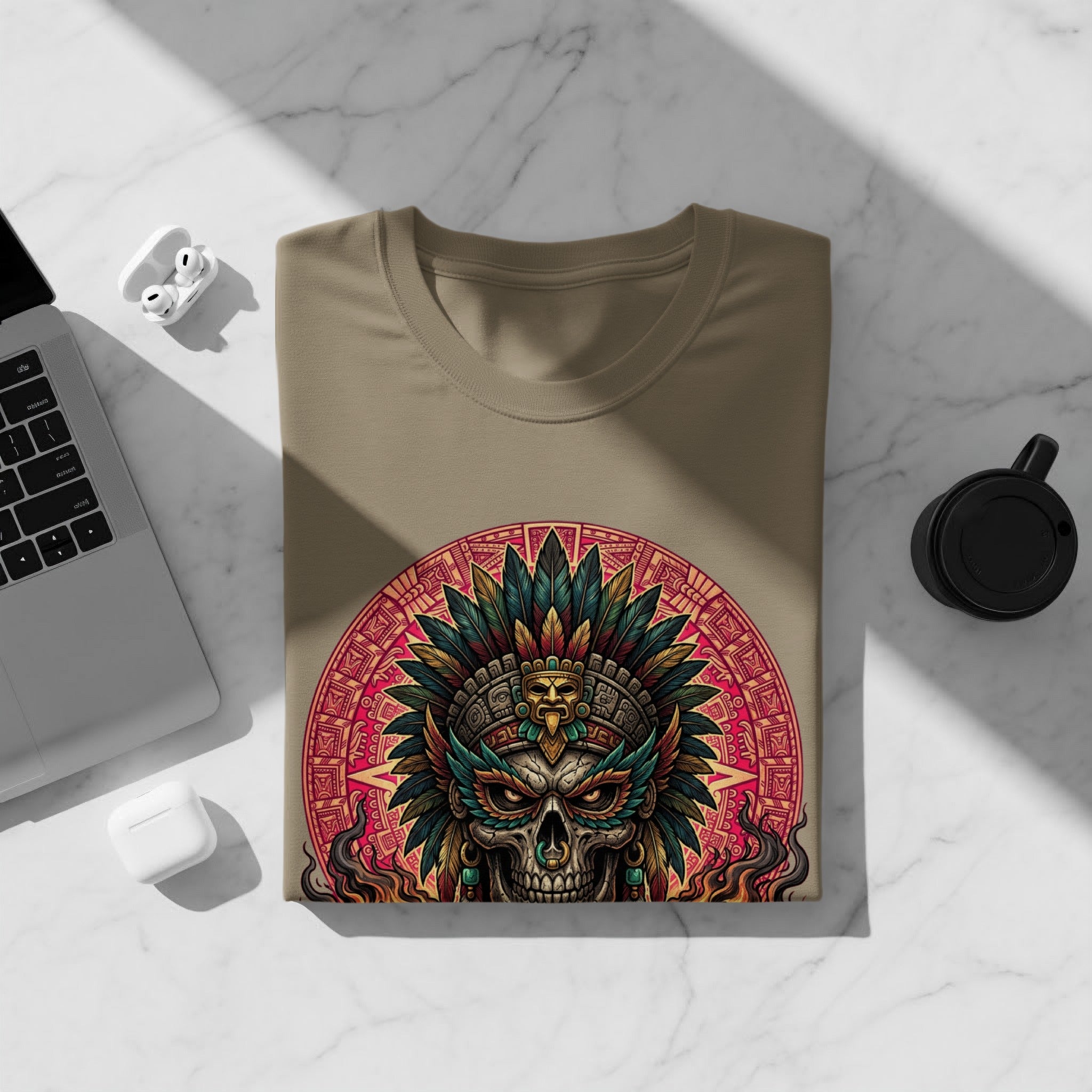 T-shirt with an Aztec skull and headdress design on a light brown background.