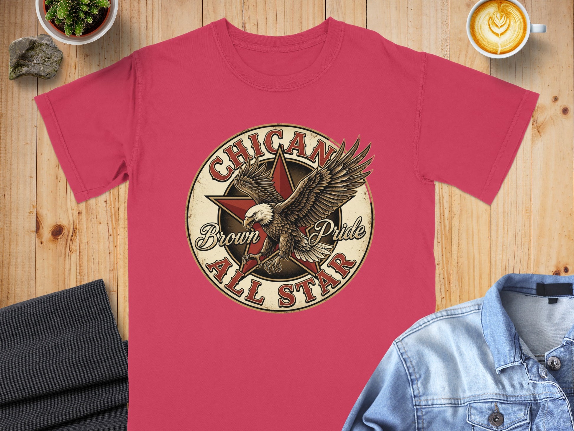 Pink t-shirt with "Chican Brown All Star" text and eagle graphic.