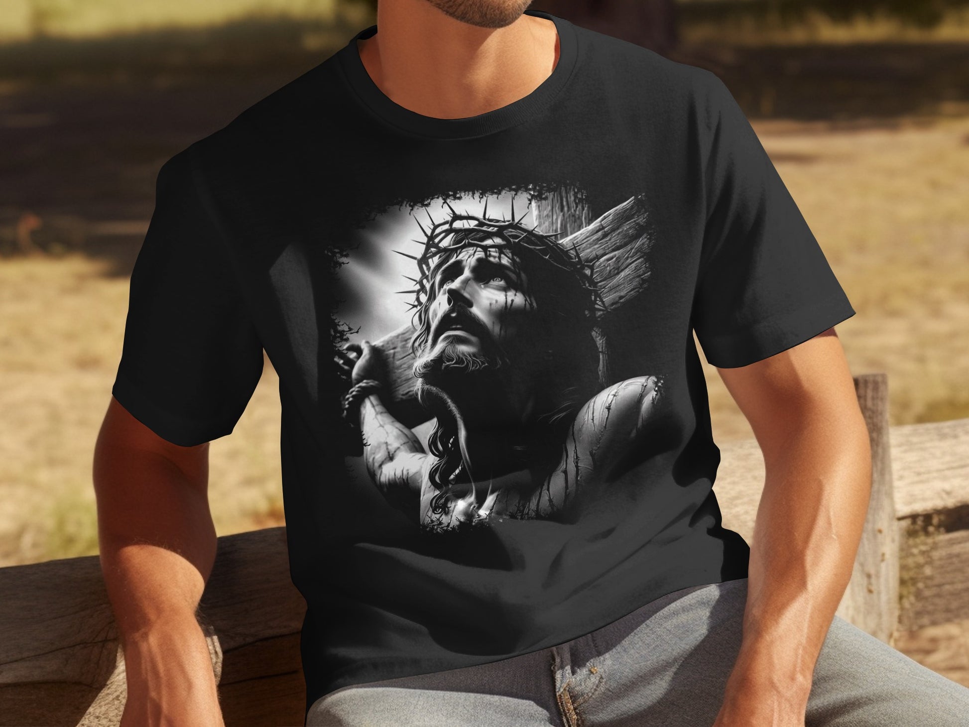 Black t-shirt with a black and white graphic of Jesus Christ wearing a crown of thorns.