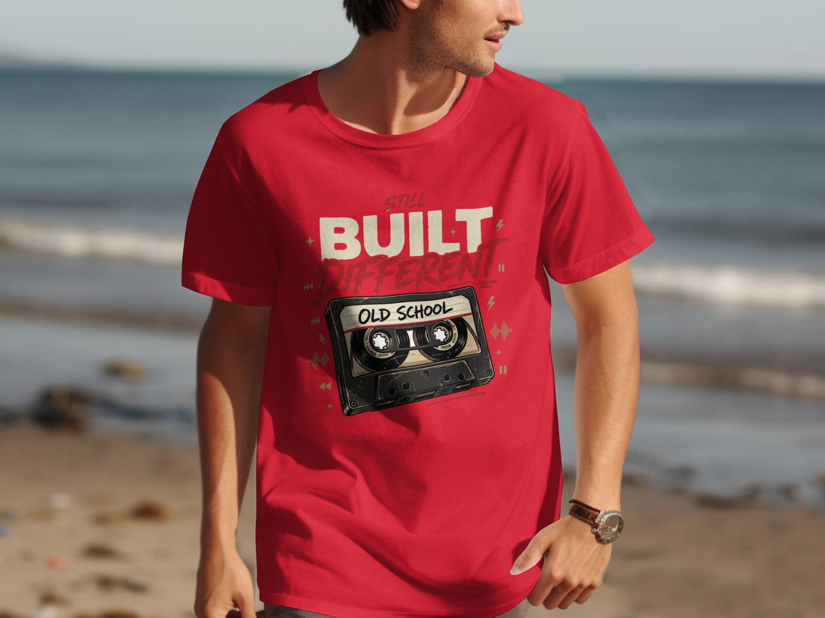 Red t-shirt with "Still Built Different Old School" text and cassette tape graphic.