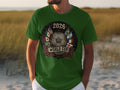 Green t-shirt with 2026 World Cup graphic featuring soccer ball and flags.