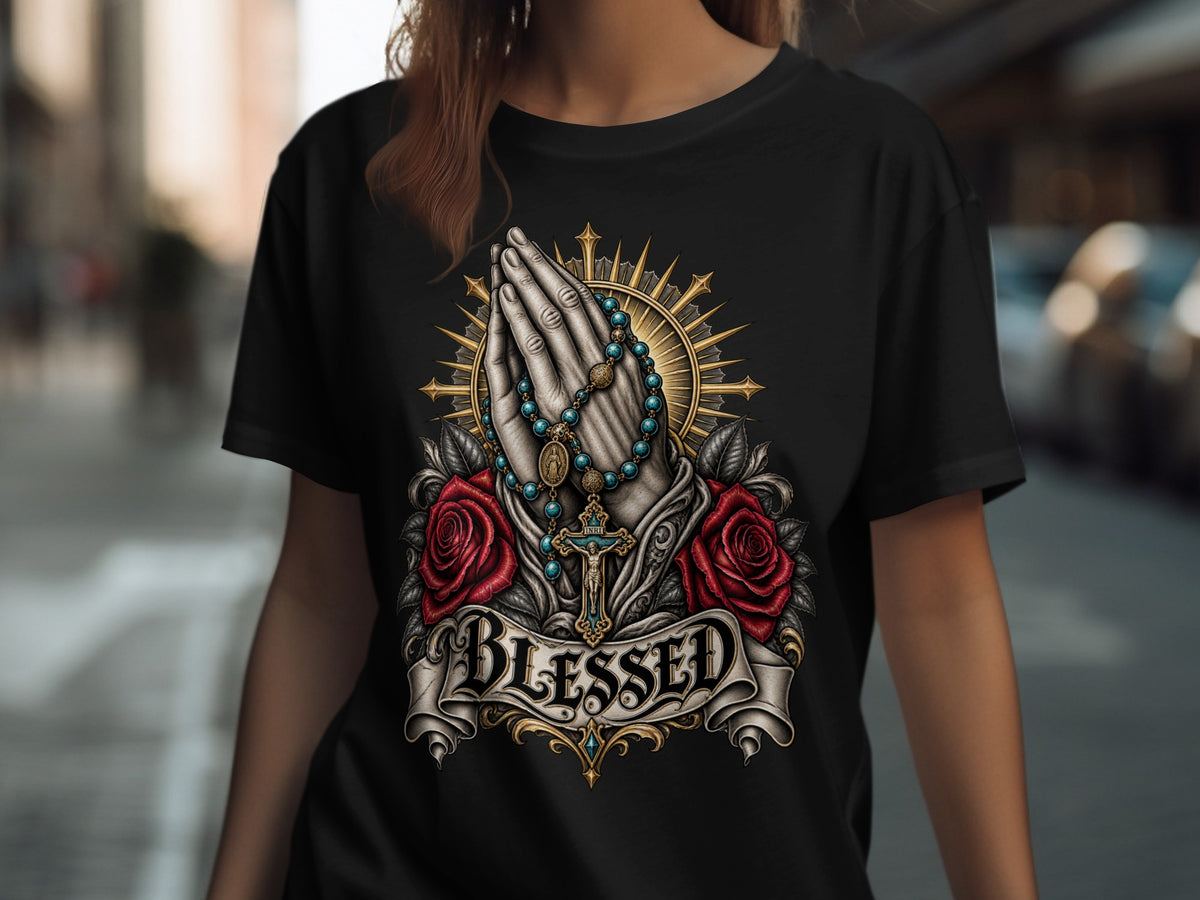 Black t-shirt with praying hands, rosary, roses, crucifix, and the word BLESSED.