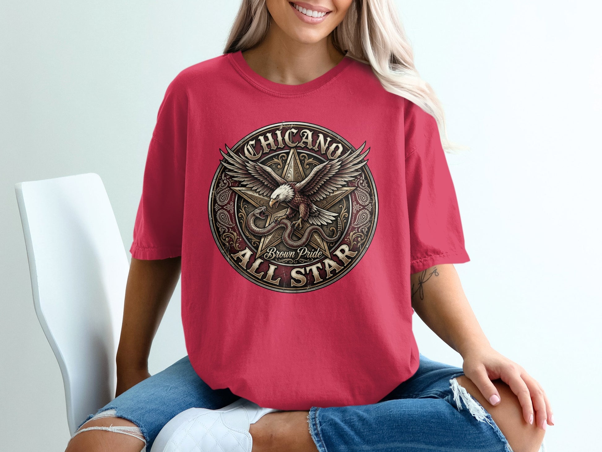 Crimson t-shirt with circular Chicano Brown Pride All Star eagle graphic.