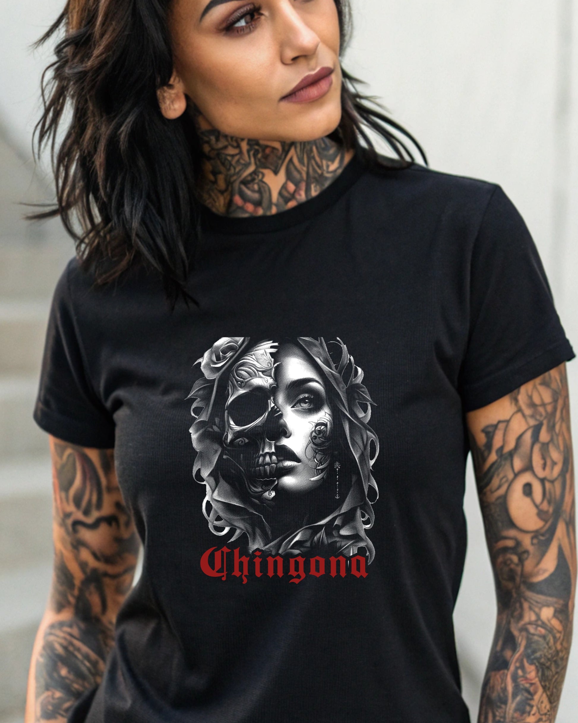 Black t-shirt with a split skull and female face design and "Chingona" text.