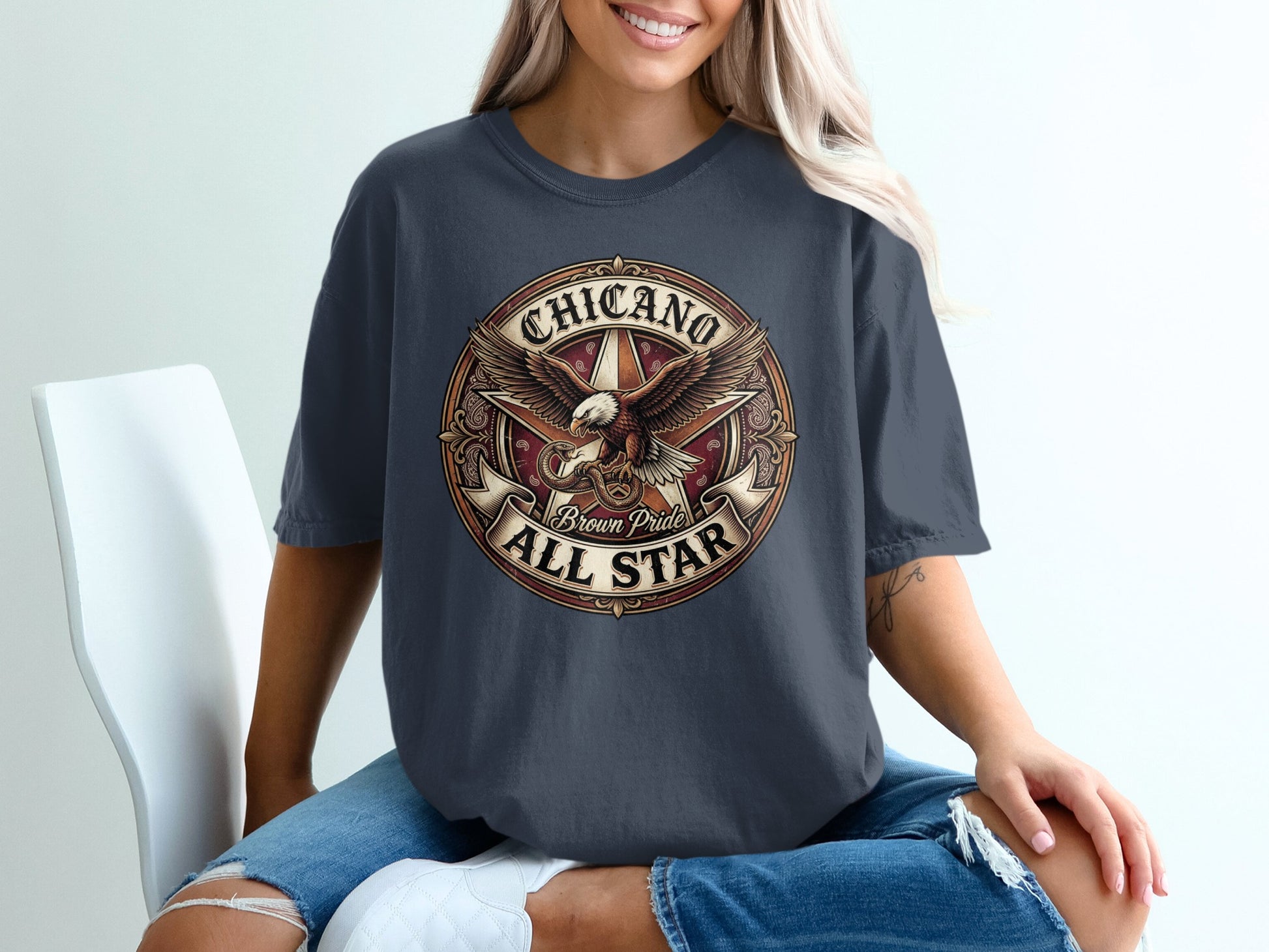 Chicano Brown Pride All Star eagle logo t-shirt on a woman.