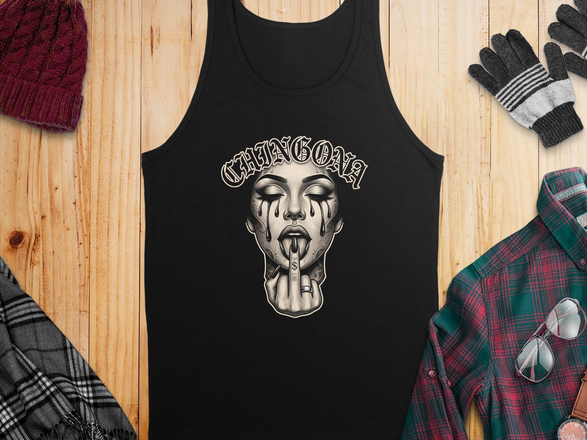 Black tank top with "CHINGONA" text and a tattooed woman's face.