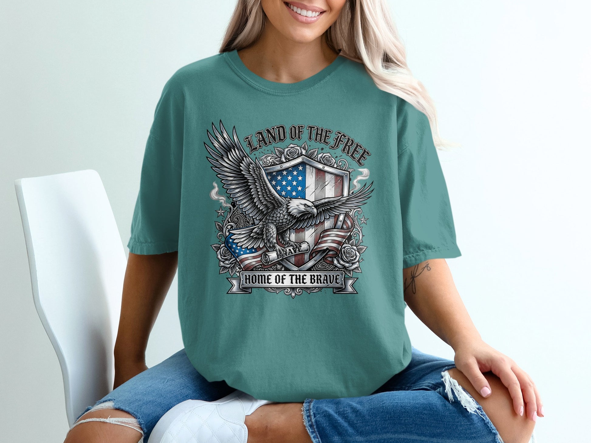Eagle and shield emblem with "Land of the Free Home of the Brave" text.