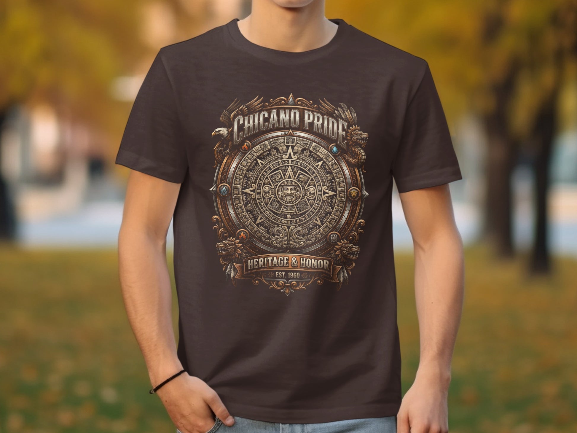 Dark brown t-shirt with Aztec calendar design and text "CHICANO PRIDE HERITAGE & HONOR EST. 1960".