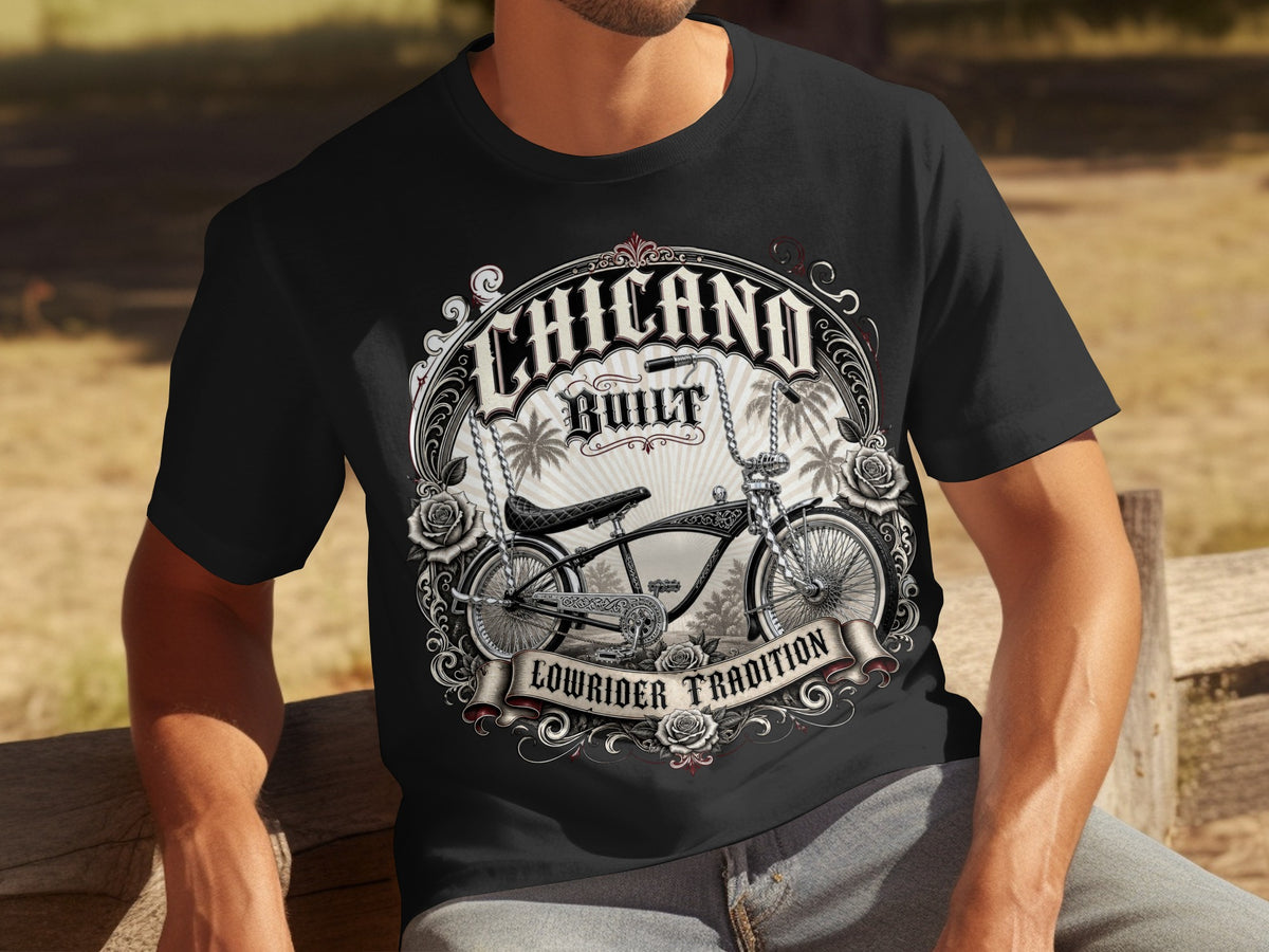 Black t-shirt with "Chicano Built Lowrider Tradition" graphic and a vintage bicycle.
