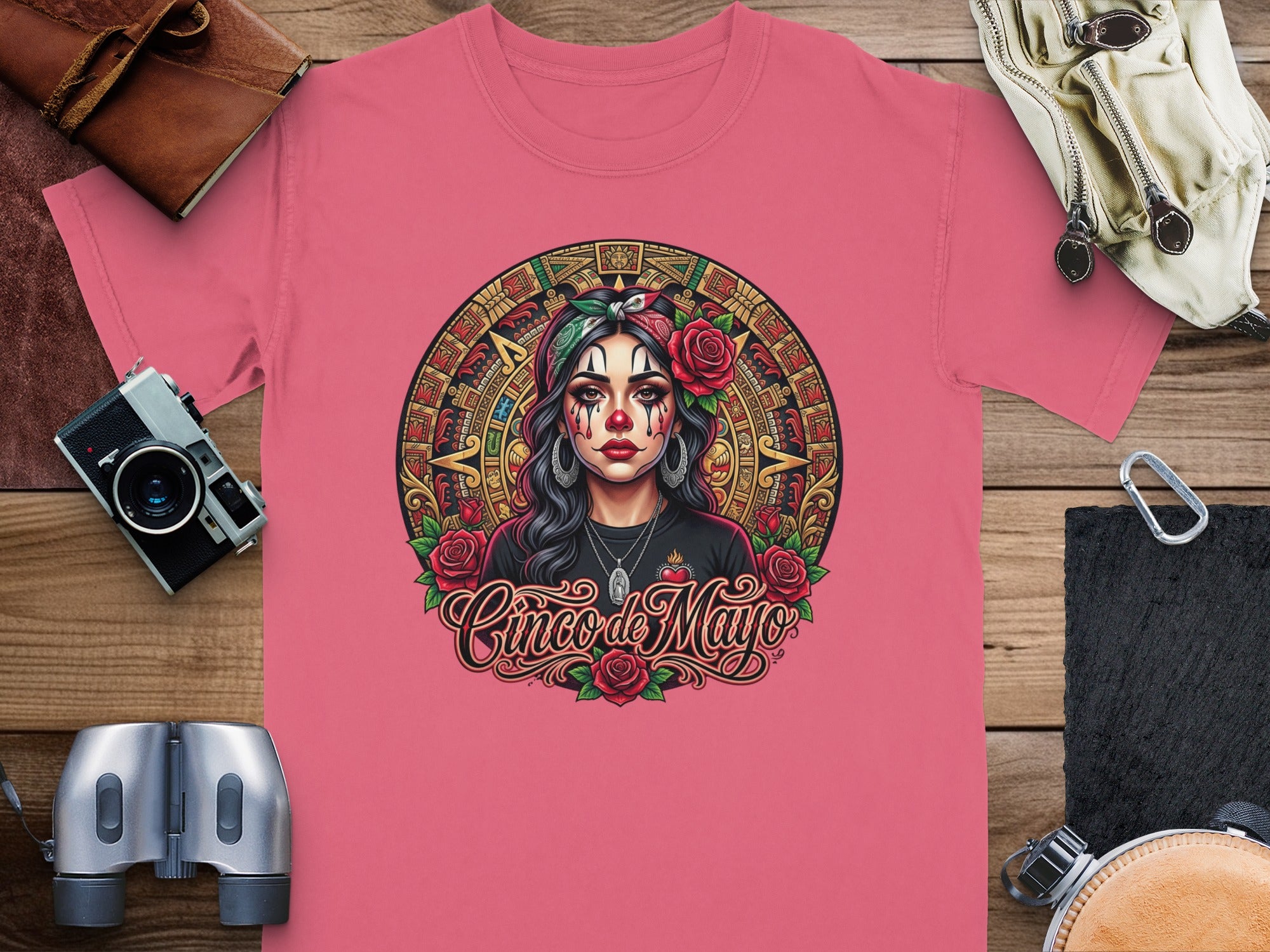 Pink t-shirt with a Dia de Muertos inspired woman and "Cinco de Mayo" text.