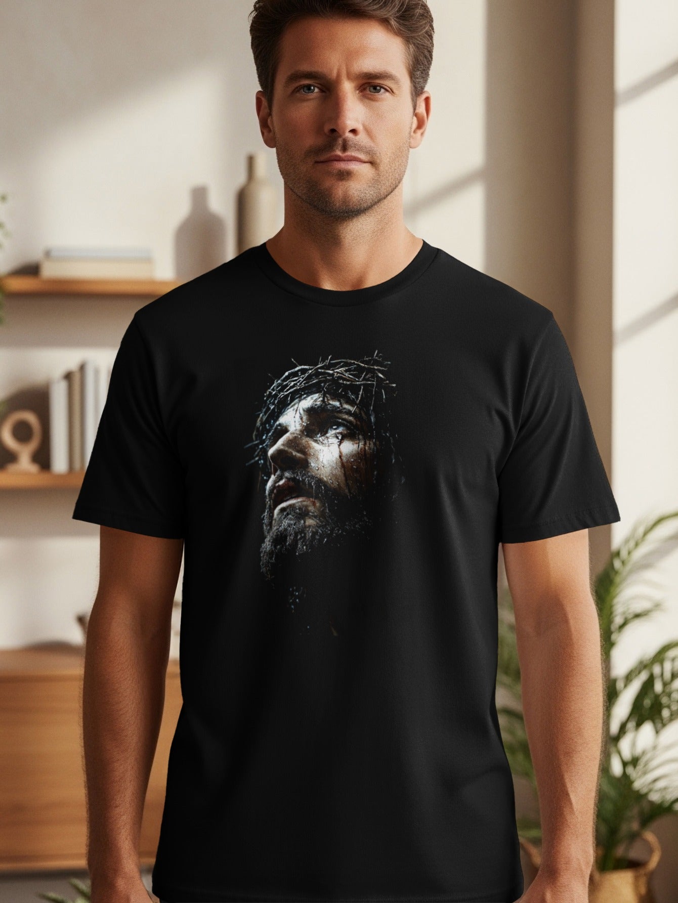 Black t-shirt featuring a dramatic, close-up portrait of Jesus crowned with thorns.