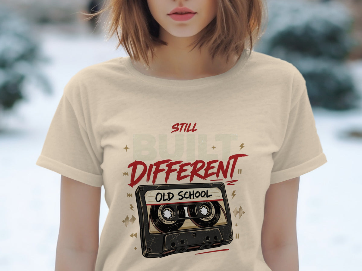 T-shirt with vintage cassette tape graphic and text "STILL BUILT DIFFERENT OLD SCHOOL".