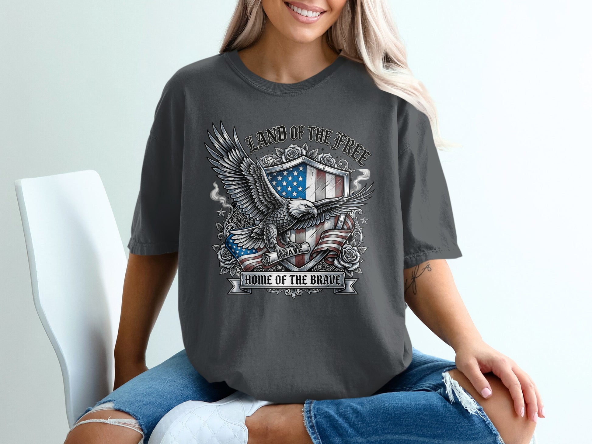 Dark gray t-shirt with eagle, flag, and "Land of the Free Home of the Brave" text.