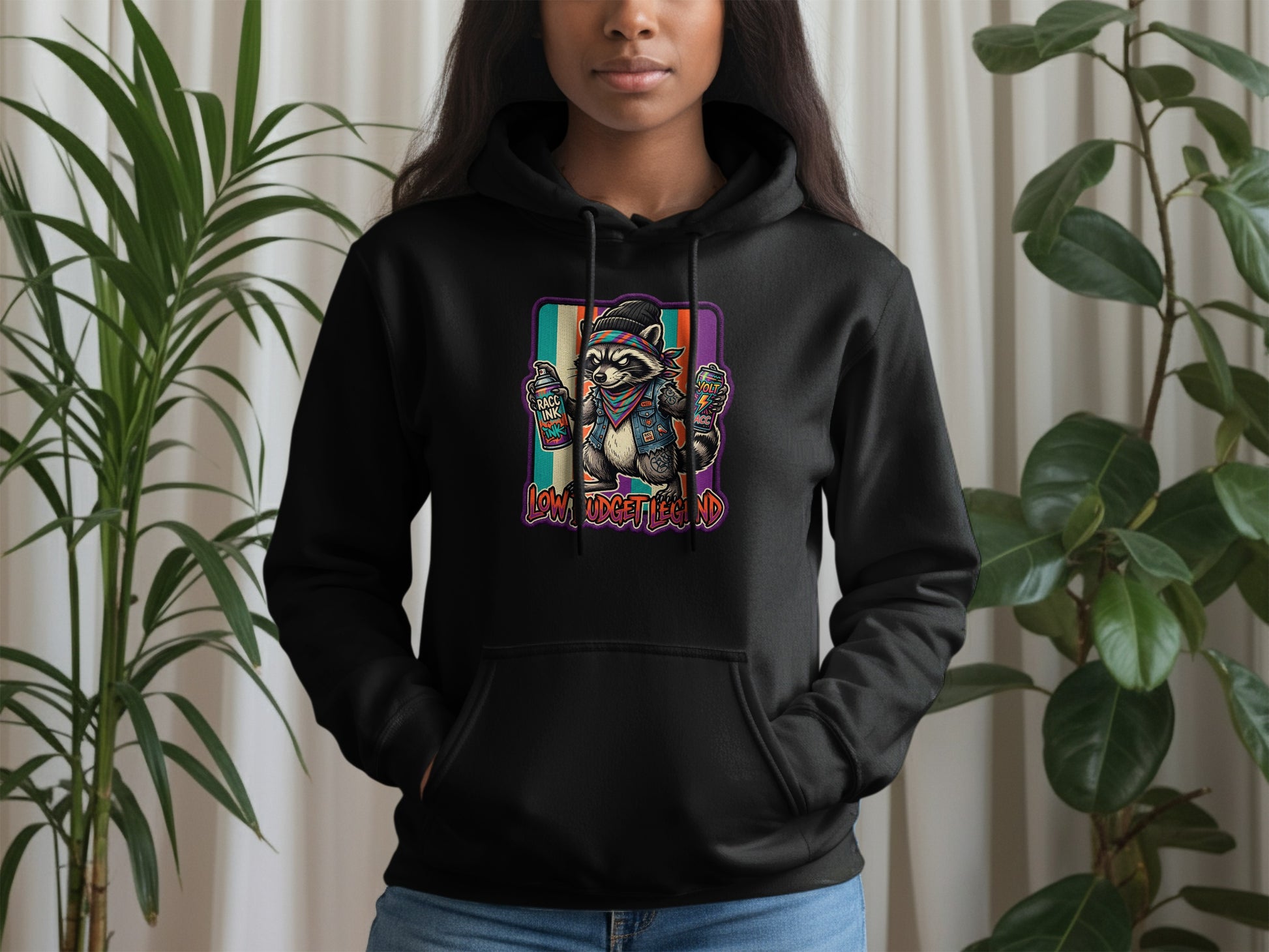 Black hoodie with a colorful graffiti raccoon graphic on the chest.