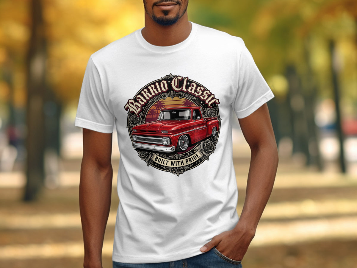 White t-shirt with graphic of red classic pickup truck and "Barrio Classic Built With Pride" text.