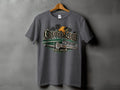 T-shirt graphic with green lowrider car, palm trees, sunset, and 