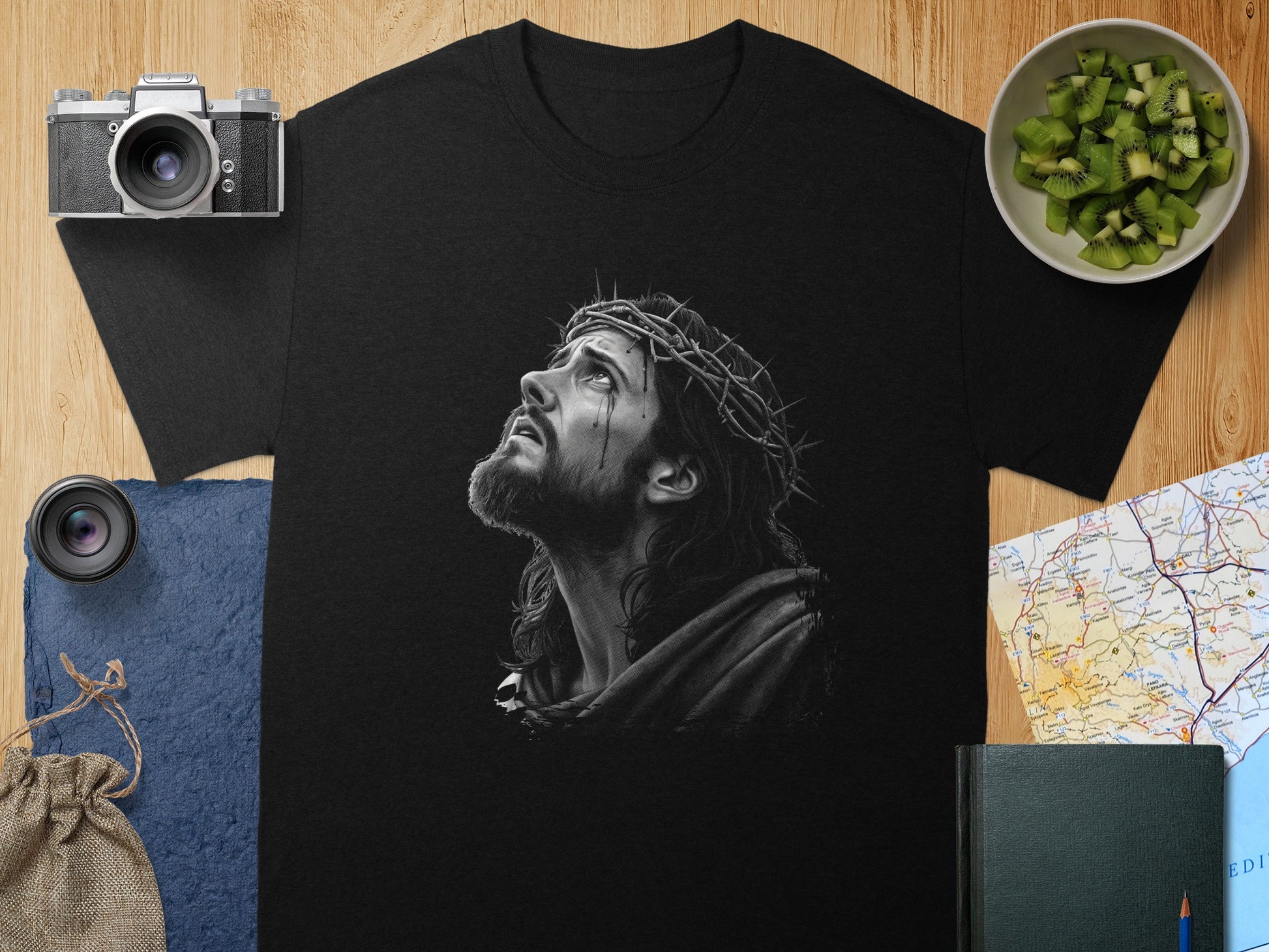 Black t-shirt featuring a detailed drawing of Jesus with a crown of thorns.