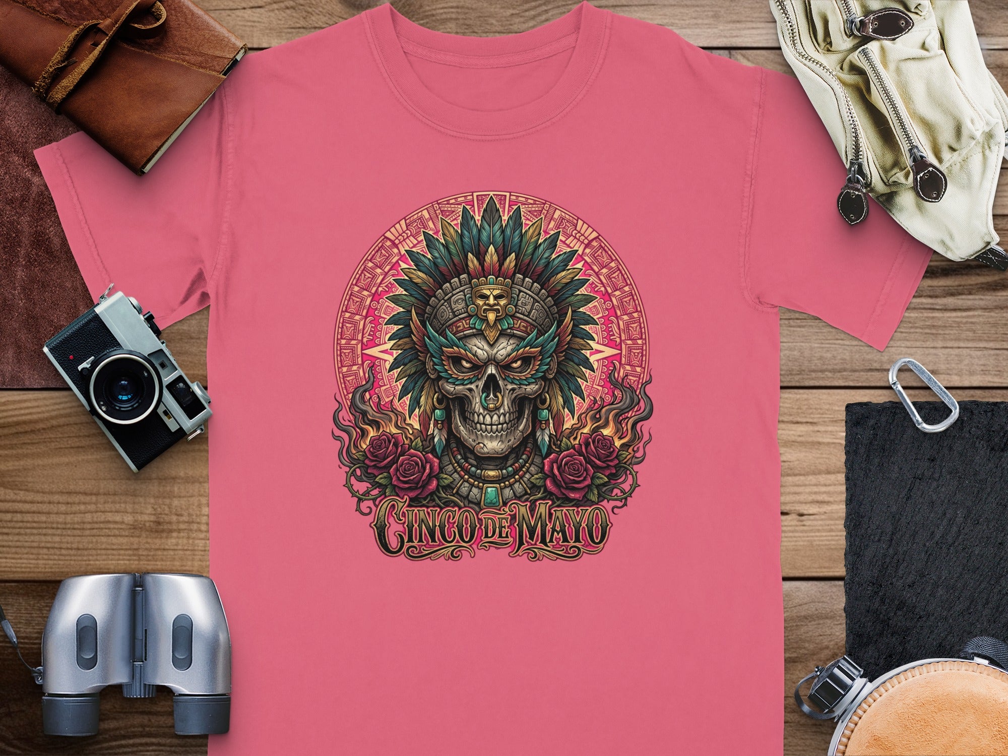 Pink t-shirt with skull wearing headdress, roses, and "Cinco de Mayo" text.