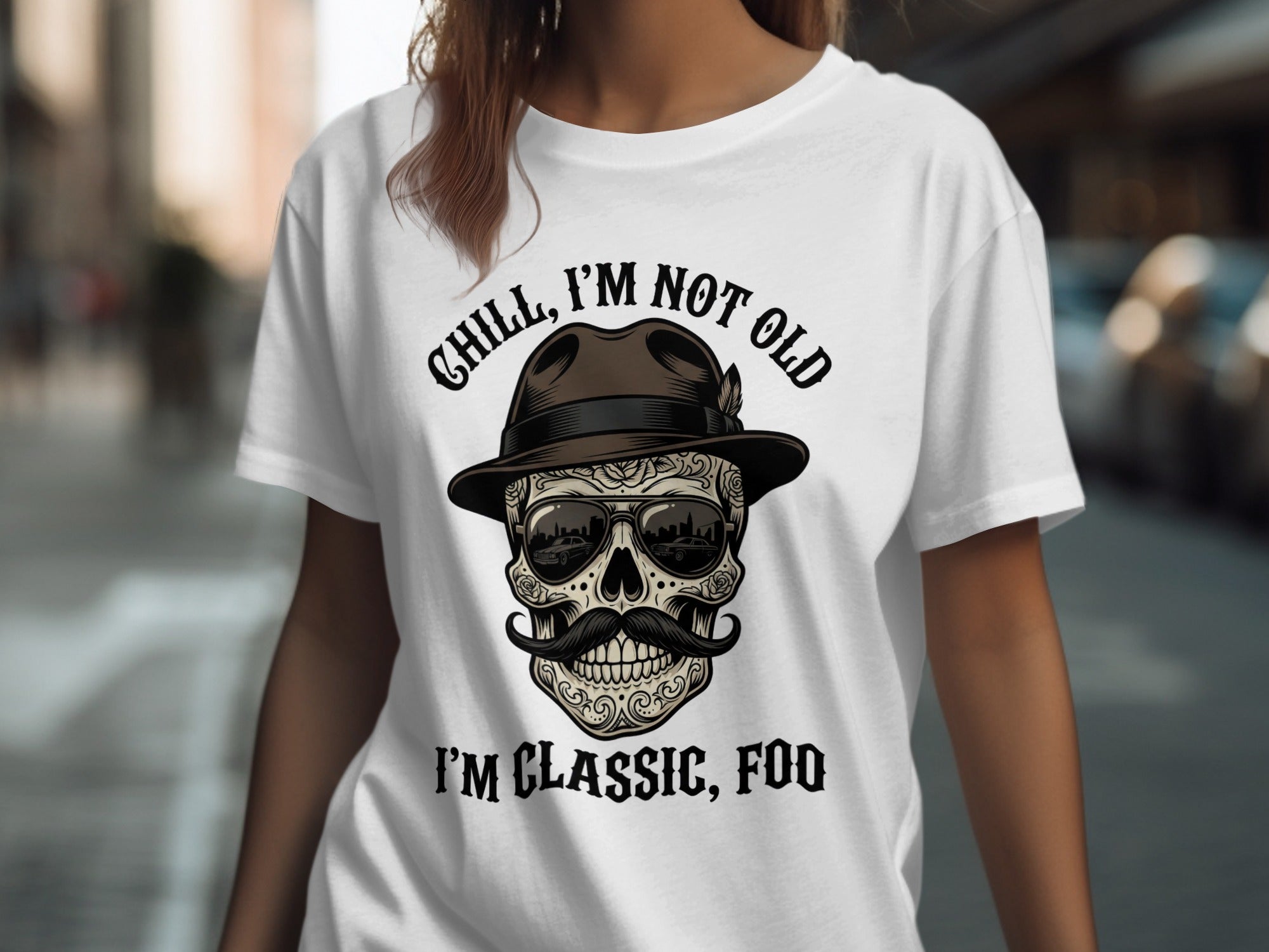 T-shirt with skull wearing sunglasses and hat, text "Chill, I'm not old. I'm classic, foo."