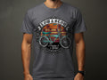 T-shirt graphic with teal lowrider bike, palm trees, and text 
