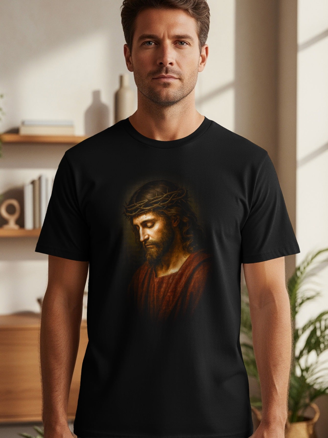 Jesus Christ wearing a crown of thorns, printed on a black t-shirt.