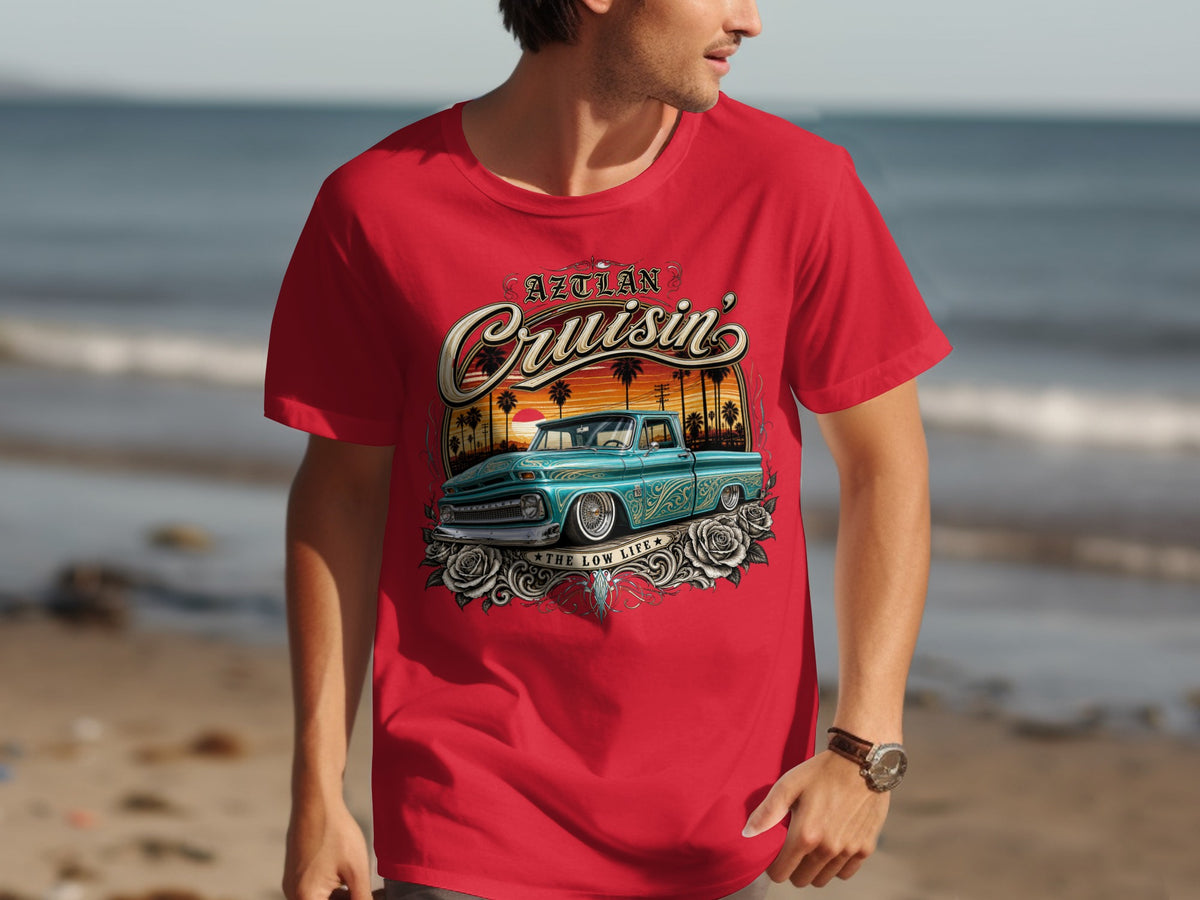 Red t-shirt with graphic of a teal lowrider truck and "Aztlán Cruisin'" text.