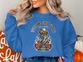 Blue sweatshirt with World Cup 2026 North America trophy graphic and roses.