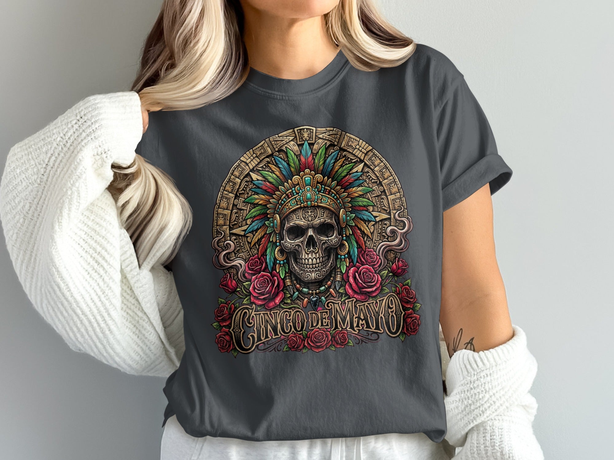 Skull with headdress and roses, "Cinco de Mayo" text.