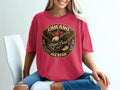 Red t-shirt with circular Chicano Brown Pride All Star eagle graphic.