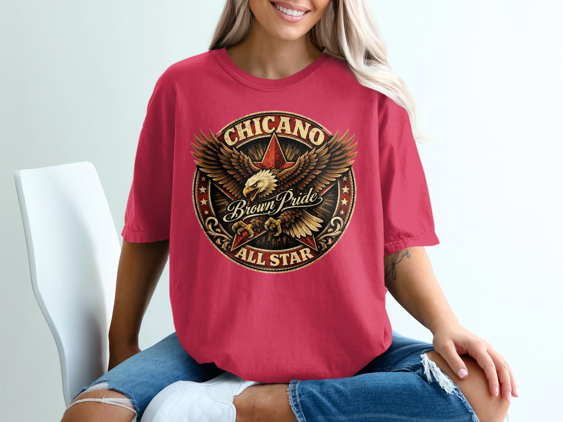 Red t-shirt with circular Chicano Brown Pride All Star eagle graphic.